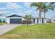 Updated home exterior boasts a modern design, fresh landscaping, and a spacious driveway at 2932 Carriage Dr, Daytona Beach, FL 32119