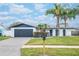 Updated home exterior boasts a modern design, fresh landscaping, and a spacious driveway at 2932 Carriage Dr, Daytona Beach, FL 32119