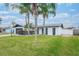 Updated home exterior with modern design, landscaping, and spacious yard at 2932 Carriage Dr, Daytona Beach, FL 32119
