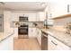 Modern kitchen with white shaker cabinets and granite countertops at 2932 Carriage Dr, Daytona Beach, FL 32119