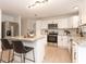 Modern kitchen with white cabinets and granite countertops at 2932 Carriage Dr, Daytona Beach, FL 32119