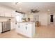 Open concept kitchen and dining area with island and modern lighting at 2932 Carriage Dr, Daytona Beach, FL 32119