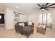 Bright living room with sectional sofa, two armchairs, and barn door at 2932 Carriage Dr, Daytona Beach, FL 32119