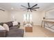 Bright living room with hardwood floors and stylish sectional sofa at 2932 Carriage Dr, Daytona Beach, FL 32119