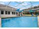 Refreshing screened pool with a view of the home at 2939 Ruggles Dr, Deland, FL 32720