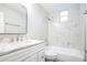 Updated bathroom with marble tile and a bathtub at 308 Wade Ave, Deland, FL 32724