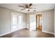 Spacious bedroom with wood-look floors and access to a patio at 308 Wade Ave, Deland, FL 32724