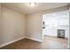 Bright dining area with wood-look floors and an open view to the kitchen at 308 Wade Ave, Deland, FL 32724