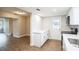 Modern kitchen with white cabinets, stainless steel appliances, and access to backyard at 308 Wade Ave, Deland, FL 32724