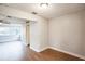 Spacious living room featuring wood-look floors and ample natural light at 308 Wade Ave, Deland, FL 32724