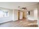 Spacious living room with hardwood floors and ceiling fan at 308 Wade Ave, Deland, FL 32724