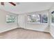 Sunlit living room with wood-look floors and access to the outdoors at 308 Wade Ave, Deland, FL 32724