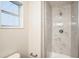 Modern shower with marble-look tiles and a new fixture at 308 Wade Ave, Deland, FL 32724