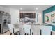 Kitchen island with granite countertops and stainless steel appliances at 316 Corso Loop, Winter Haven, FL 33884