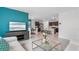 Open living room showcasing a comfortable couch and a view into the kitchen at 316 Corso Loop, Winter Haven, FL 33884