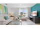 Spacious living room with two white sofas, coffee table, and natural light at 316 Corso Loop, Winter Haven, FL 33884