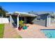 Inviting backyard with patio, pool, and lush landscaping at 326 Benton St, Orlando, FL 32839