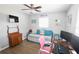 Bedroom with twin daybed, workspace, and antique dresser at 326 Benton St, Orlando, FL 32839