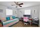 Bedroom featuring a daybed, workspace, and ceiling fan at 326 Benton St, Orlando, FL 32839