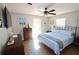 Bedroom with a king-size bed, ceiling fan and large windows at 326 Benton St, Orlando, FL 32839