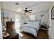 Spacious bedroom with queen bed, wood-look floors, and access to the backyard at 326 Benton St, Orlando, FL 32839