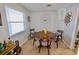 Cozy dining area features a round wooden table and gray chairs at 326 Benton St, Orlando, FL 32839