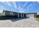 Gray house with a white garage and a paved driveway at 326 Benton St, Orlando, FL 32839