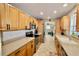 Well-equipped kitchen with stainless steel appliances and wood cabinets at 326 Benton St, Orlando, FL 32839