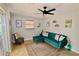 Living area showcasing a teal sectional and access to backyard at 326 Benton St, Orlando, FL 32839