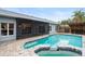 Home exterior showcasing a screened patio and refreshing pool at 3475 Woodley Park Pl, Oviedo, FL 32765