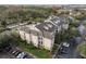 Aerial view of apartment building with pool and parking at 3583 Conroy Rd # 1135, Orlando, FL 32839
