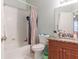 Clean bathroom with granite vanity, shower/tub combo, and tile flooring at 3583 Conroy Rd # 1135, Orlando, FL 32839