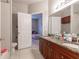 Shared bathroom with double vanity and a bedroom view at 3583 Conroy Rd # 1135, Orlando, FL 32839