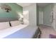 Serene bedroom with plush carpet, neutral color palette, and access to bathroom at 3583 Conroy Rd # 1135, Orlando, FL 32839