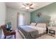 Spacious bedroom with large bed, ceiling fan, and ample natural light at 3583 Conroy Rd # 1135, Orlando, FL 32839