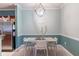 Simple dining area with light wood table and chairs at 3583 Conroy Rd # 1135, Orlando, FL 32839