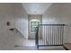 Well-lit interior stairwell with metal railing and window at 3583 Conroy Rd # 1135, Orlando, FL 32839