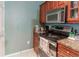 Bright kitchen features granite countertops and stainless steel appliances at 3583 Conroy Rd # 1135, Orlando, FL 32839
