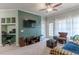 Living room with built-in workspace and balcony access at 3583 Conroy Rd # 1135, Orlando, FL 32839
