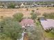 Aerial view showcases the house, backyard, and neighborhood setting at 3689 Rolling Hills Ln, Apopka, FL 32712