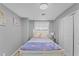 Charming bedroom with a cozy bed, modern lighting, and a window with plenty of natural light at 3689 Rolling Hills Ln, Apopka, FL 32712