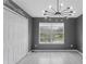 Bedroom featuring modern light fixture, light wood floors, large window and a spacious closet at 3689 Rolling Hills Ln, Apopka, FL 32712