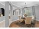 Elegant dining room with chandelier and ample natural light, perfect for formal dining experiences at 3689 Rolling Hills Ln, Apopka, FL 32712