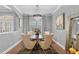 Elegant dining room featuring a chandelier, modern chairs, and stylish decor for sophisticated dining at 3689 Rolling Hills Ln, Apopka, FL 32712