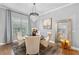 Stylish dining room showcases modern chairs, chandelier lighting, and sophisticated decor for elegant dining at 3689 Rolling Hills Ln, Apopka, FL 32712