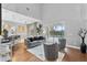 Bright living space featuring stylish seating, hardwood floors, and access to a screened-in pool area at 3689 Rolling Hills Ln, Apopka, FL 32712