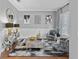Cozy living room with decorative furniture, modern art, and a stylish mirror, creating an inviting atmosphere at 3689 Rolling Hills Ln, Apopka, FL 32712