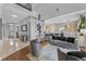Open concept living area with stylish furniture, offering a seamless transition to the modern kitchen at 3689 Rolling Hills Ln, Apopka, FL 32712