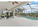 Screened lanai featuring a pool and an outdoor seating, providing a relaxing and private outdoor experience at 3689 Rolling Hills Ln, Apopka, FL 32712