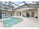 Inviting screened-in pool and deck area with seating, ideal for outdoor entertaining and enjoying sunny days at 3689 Rolling Hills Ln, Apopka, FL 32712